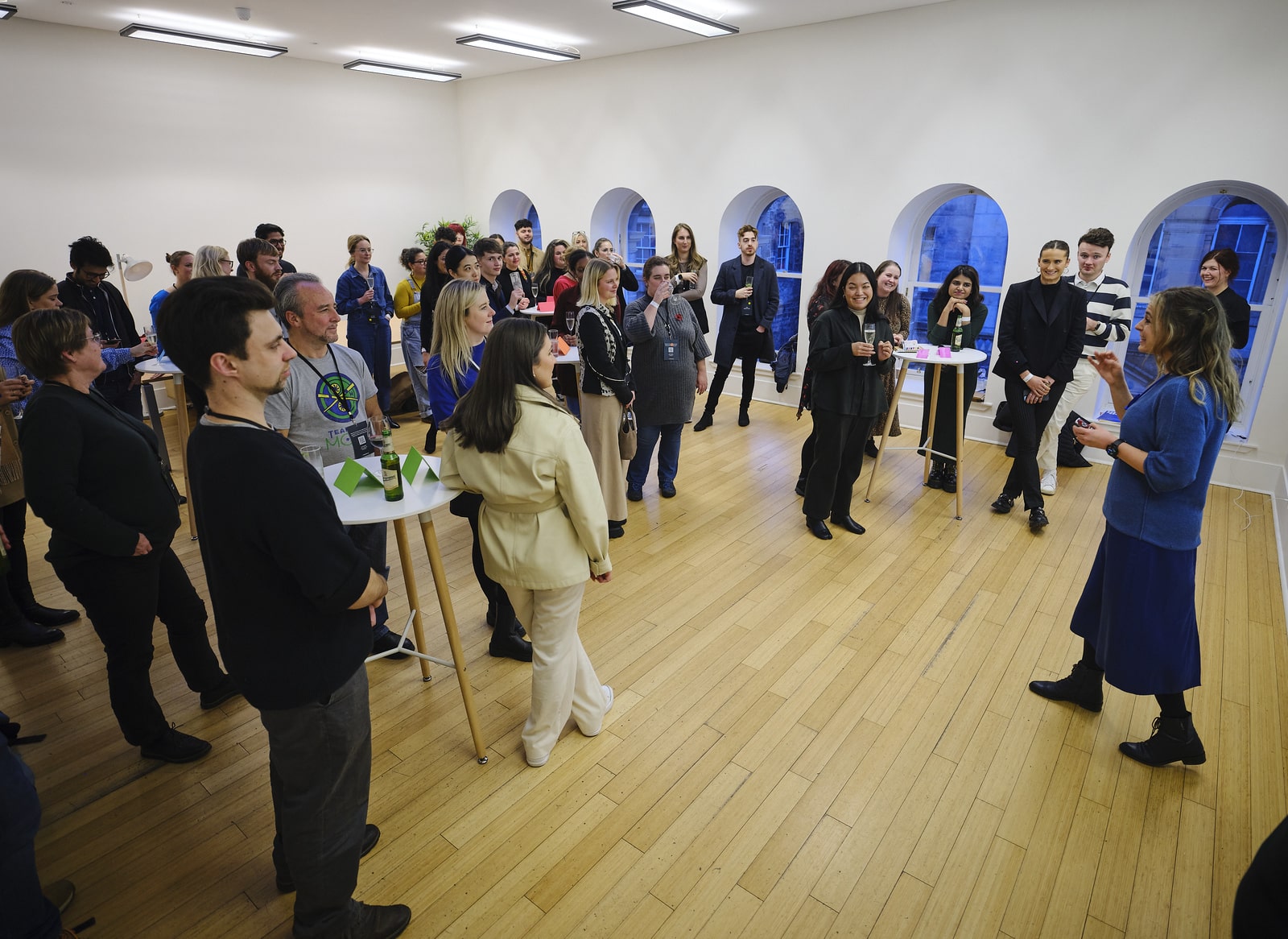 Georgie Browne leading a Sonas Method networking session, participants standing in a circle
